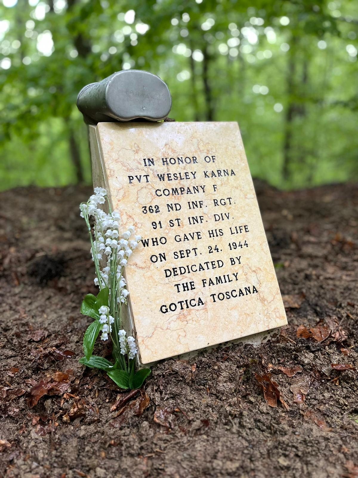 Memorial stone near the Futa Pass with Wesley Karna's canteen cup